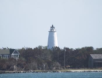 Ocracoke Lighthouse from Silver Lake. The lighthouse and grounds are slated for renovation. Ocracoke Lighthouse from Silver Lake. The lighthouse and grounds are slated for renovation.