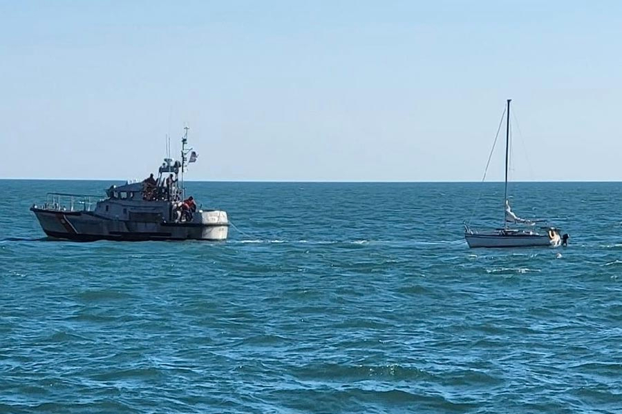 47' Coast Guard Lifeboat tows a damaged sailboat to safety. 47' Coast Guard Lifeboat tows a damaged sailboat to safety.