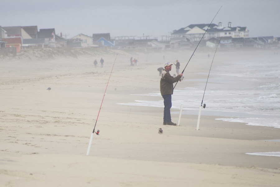 Fishing for sea mullet or whatever grabs the bait on an Outer Banks beach. Fishing for sea mullet or whatever grabs the bait on an Outer Banks beach.